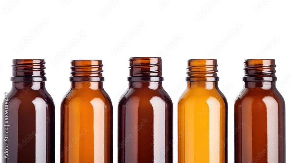 Five amber glass bottles with various neck designs on a white isolated background. transparent background. Five amber glass bottles with various neck designs on a white isolated background. transparent background.