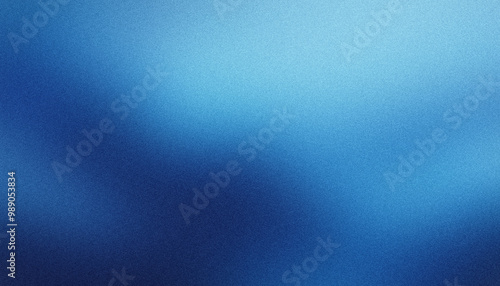 Fototapeta Naklejka Na Ścianę i Meble -  Elegant blue abstract background with a textured grain and light reflections, ideal for adding sophistication to any project