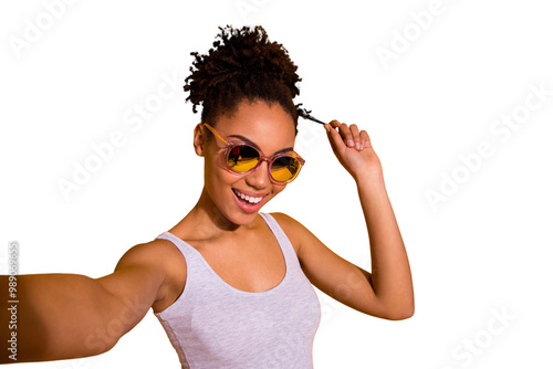 Close up photo beautiful nice pretty she her dark skin lady summer weekend rest relax make take selfies blogger play fingers wind curl wear sun specs casual tank-top isolated bright yellow background photo