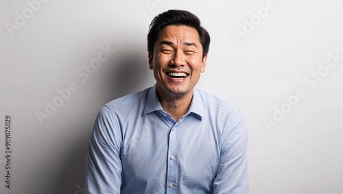 Amused man in plain white background