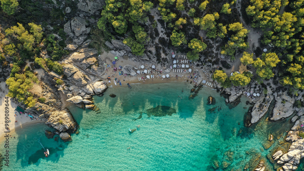 Paradise Found: A hidden beach cove where the turquoise waters meet the rugged cliffs, offering the perfect summer escape in Greece Paradise Found: A hidden beach cove where the turquoise waters meet the rugged cliffs, offering the perfect summer escape in Greece