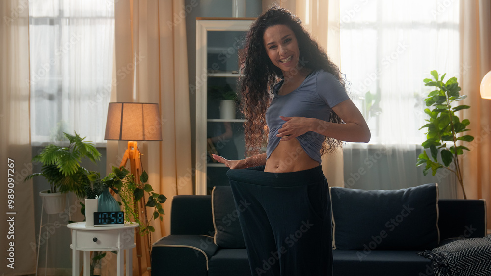 Φωτογραφία Proud amazed smiling Hispanic ethnic woman happy sportswoman female fitness girl