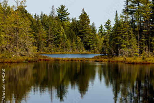 A small section of a bog has sealed the two intersecting sections of Devils Lake near Boulder Junction, Wisconsin in mid-September. This use to be fully open