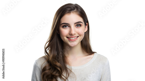 Smiling brunette teen with long hair, looking at camera, studio portrait