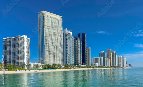 Miami Sunny Isles Beach Florida. Panorama of Miami Beach FL. Atlantic Ocean beach. Beautiful seascape. Cityscape with skyscrapers, skyline. Summer vacation in Florida. Hotels and Resorts on Island photo