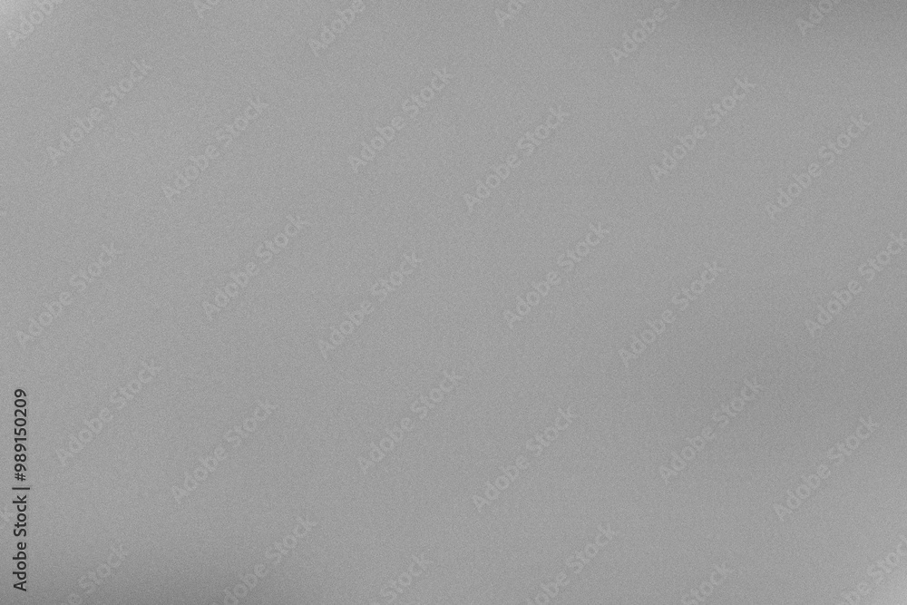 The gray surface displays a smooth and even texture, ideal for a minimalist backdrop or design project, capturing a calm and elegant aesthetic The gray surface displays a smooth and even texture, ideal for a minimalist backdrop or design project, capturing a calm and elegant aesthetic