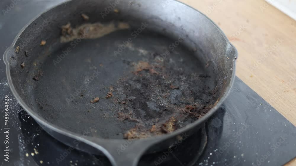 the frying pan is dirty and burnt the frying pan is dirty and burnt