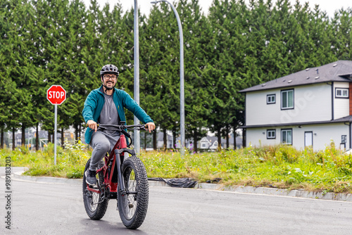 Man Enjoying a Relaxing Bike Ride on a Peaceful Street in Mission, BC, Canada