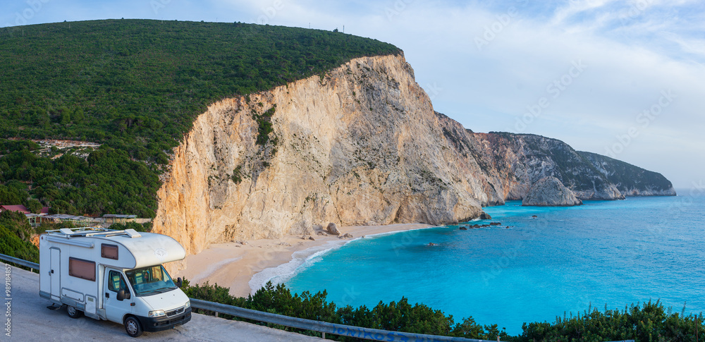 Serene seaside rv camping experience, Motorhome parked by a tranquil coastal inlet under a clear blue sky. Lefkada, Greece.