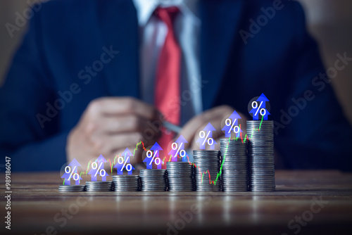 Businessman putting down money, pointing with pen and showing candlestick symbol for investing, finance, saving money, interest rate or dividend investment, business growth concept.