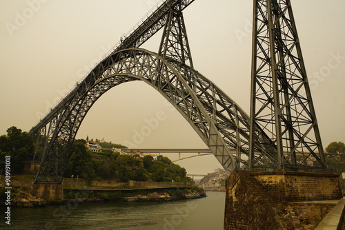 The Ponte Maria Pia was the largest arched bridge in the world when it opened in 1877. Along with the Garabit Viaduct, it is Gustave Eiffel's most famous bridge. Douro river, Porto Portugal. photo