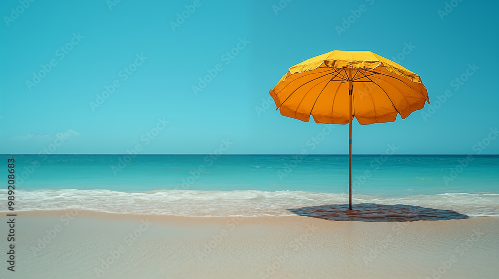 Yellow beach umbrella on tropical shore with turquoise sea Yellow beach umbrella on tropical shore with turquoise sea