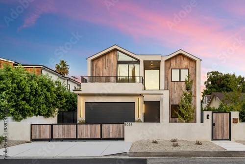 Modern house with wooden accents at sunset.