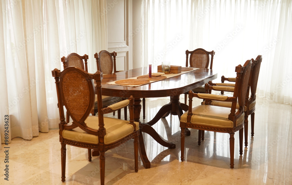 Dinning table and chairs in a living room Dinning table and chairs in a living room