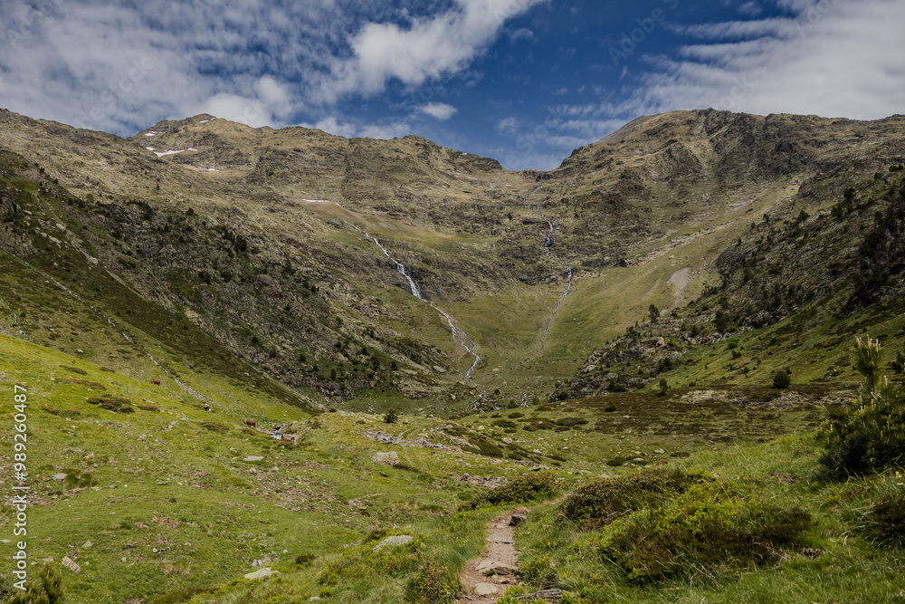 Obraz premium Natural park of valley Comapedrosa at summer with rivers and waterfalls, snow in the mountains, Andorra