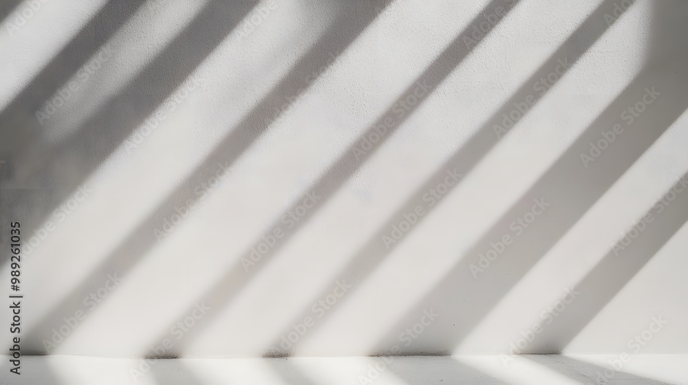 Obraz premium Blurred overlay effect for photo and mockups. Wall texture with organic drop diagonal shadow and rays of light on a white wall. shadows for natural light effects
