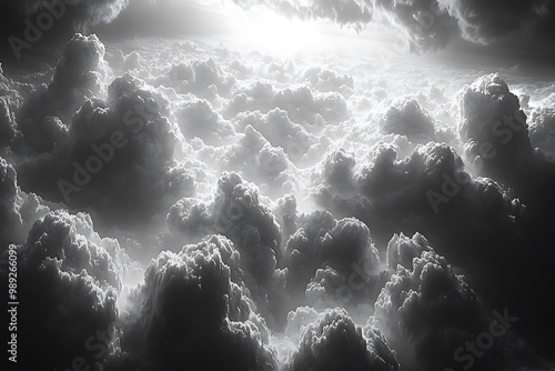 A sea of fluffy clouds illuminated by heavenly light.