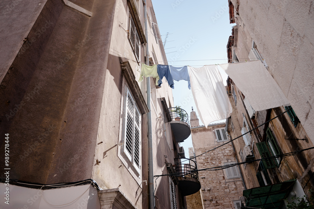 Travel by Split in Croatia. Ancient architecture of old town. Drying clothes. Travel by Split in Croatia. Ancient architecture of old town. Drying clothes.