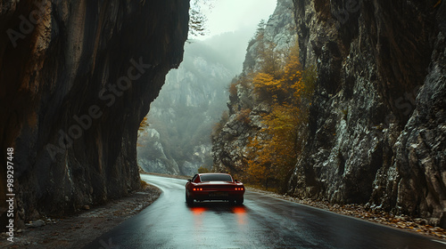 A muscle car drifting through a narrow mountain pass cliffs on either side.