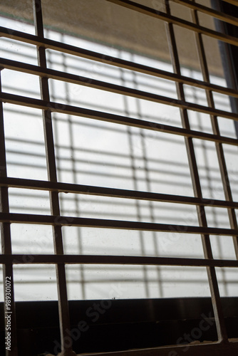 Obraz na płótnie Window grille, view from inside, backlight. w salonie