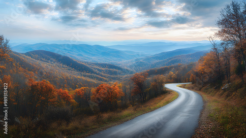 A scenic view of a winding road through the Appalachian Mountains autumn colors painting the landscape.