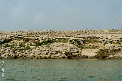 Obraz na płótnie Sandbags, geobags to protect riverbank from erosion and flooding. Bangladesh, Padma River. w salonie
