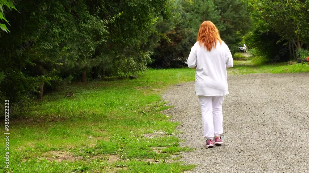Senior woman walks relaxing outdoor on nature Senior woman walks relaxing outdoor on nature