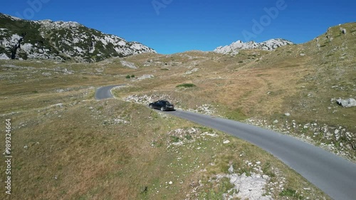 Car is driving along a mountain serpentine