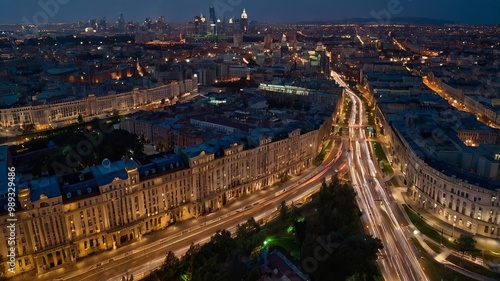 Aerial view of a city at night, showcasing illuminated streets and vibrant lights, creating a stunning urban landscape.