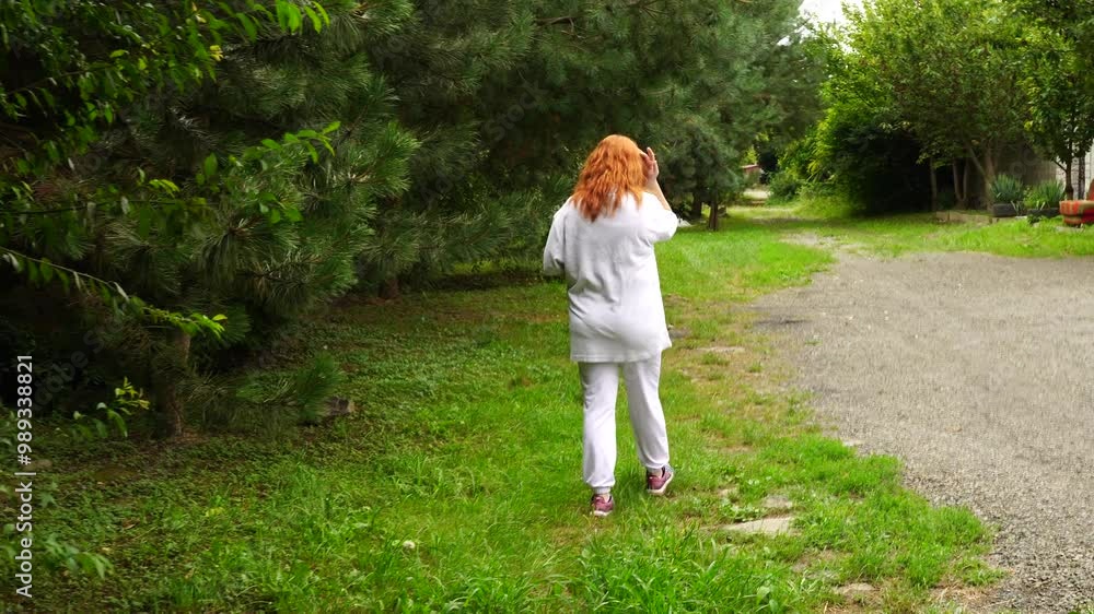 Senior woman walks relaxing outdoor on nature Senior woman walks relaxing outdoor on nature