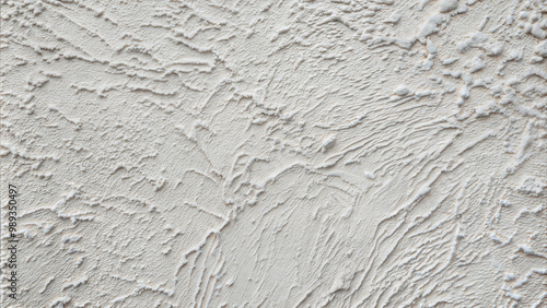 Rough plaster wall texture in soft gray with a subtle uneven surface for minimalist designs