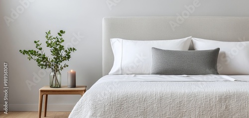 Minimalist White Bed with Gray Pillow in Serene Bedroom Interior, Soft Lighting for Home Decor Inspiration