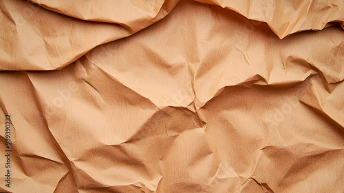 Wrinkled brown paper sheet with a textured surface, ideal for backgrounds in creative projects and design work.