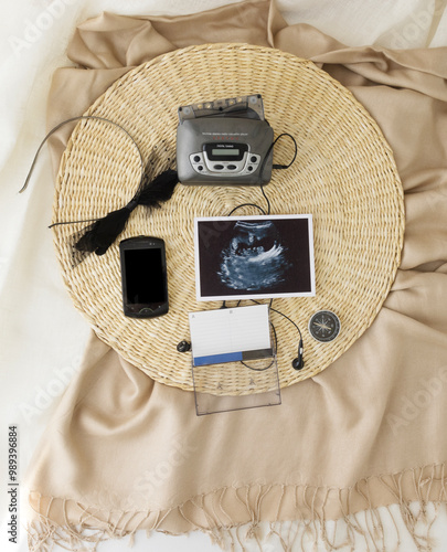 Vintage audio player and mobile phone. Mockup for pregnancy announcement. Gadgets for The 90-00's . Background with blurred . Selective focus photo