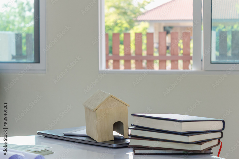 Plans and documents are placed on desks in the engineering team's office to prepare for the meeting of the designers, engineers and foreman teams to supervise the construction work as planned.