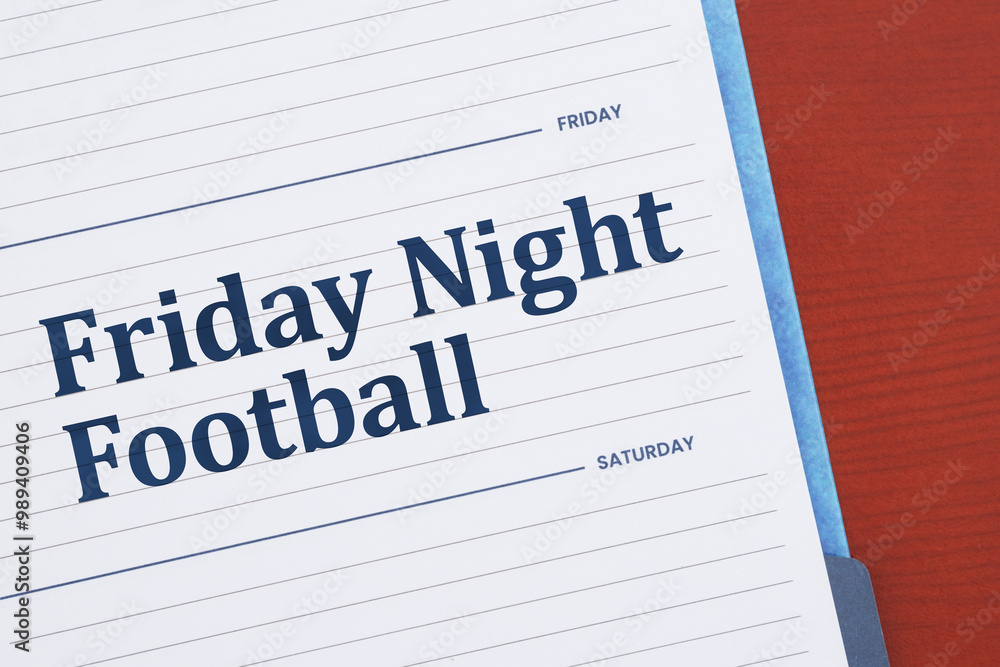 Friday Night Football on day planner on desk Friday Night Football on day planner on desk