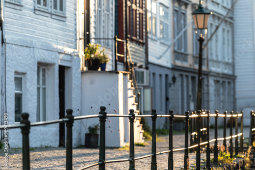 Sunset on a street with old, decorated facades; the magic of twilight between soft lights and shadows.