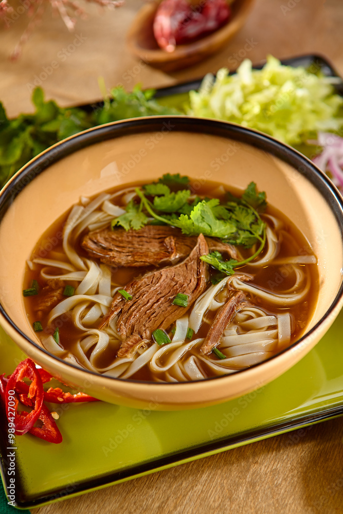 Delicious Beef Pho Bo Soup with Fresh Herbs and Rice Noodles Delicious Beef Pho Bo Soup with Fresh Herbs and Rice Noodles