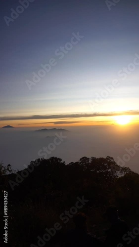 The beauty of the sunrise in the morning at an altitude of 2821 meters above sea level, Mount Cikuray Garut Indonesia photo