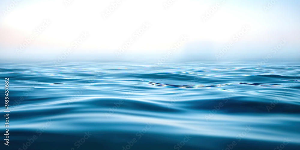The image is of a calm body of water with a blue color The image is of a calm body of water with a blue color