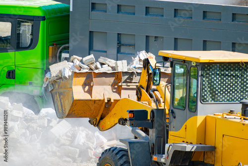 Billede på lærred Removing construction waste with a bulldozer