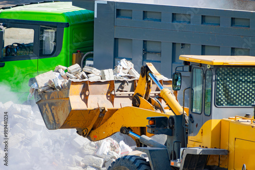 Canvas Print Removing construction waste with a bulldozer