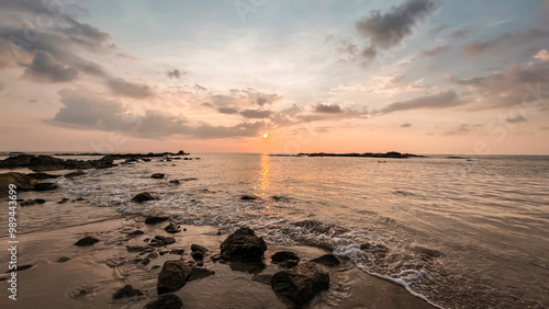 Sunset on the beach with the rock