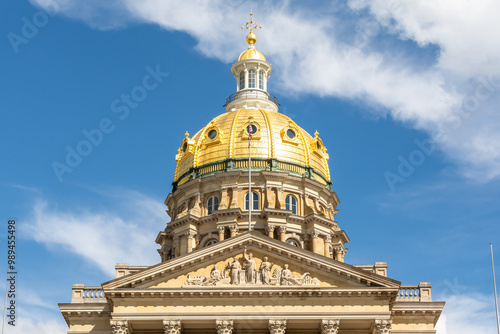 The Iowa state Capitol building on a hot late summer day with blue skies and clouds.  Des Moines, Iowa, USA. photo