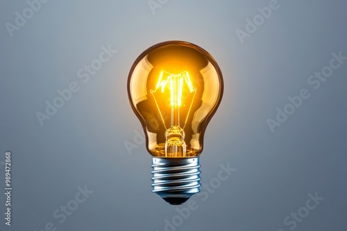 A close-up of a glowing lightbulb, suspended against a plain background, symbolizing energy and innovation in a simple form