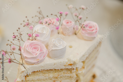 White cake with pink roses photo