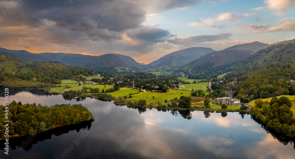 Naklejka premium Aerial panoramic landscape of the lake and village of Grasmere in The English Lake District at sunrise