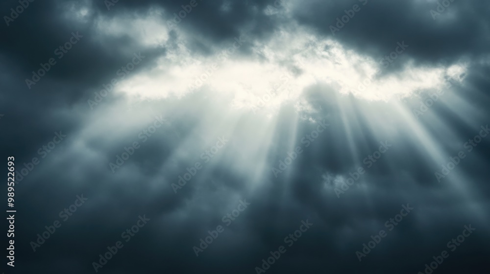 sunlight barely breaking through thick, grey clouds sunlight barely breaking through thick, grey clouds