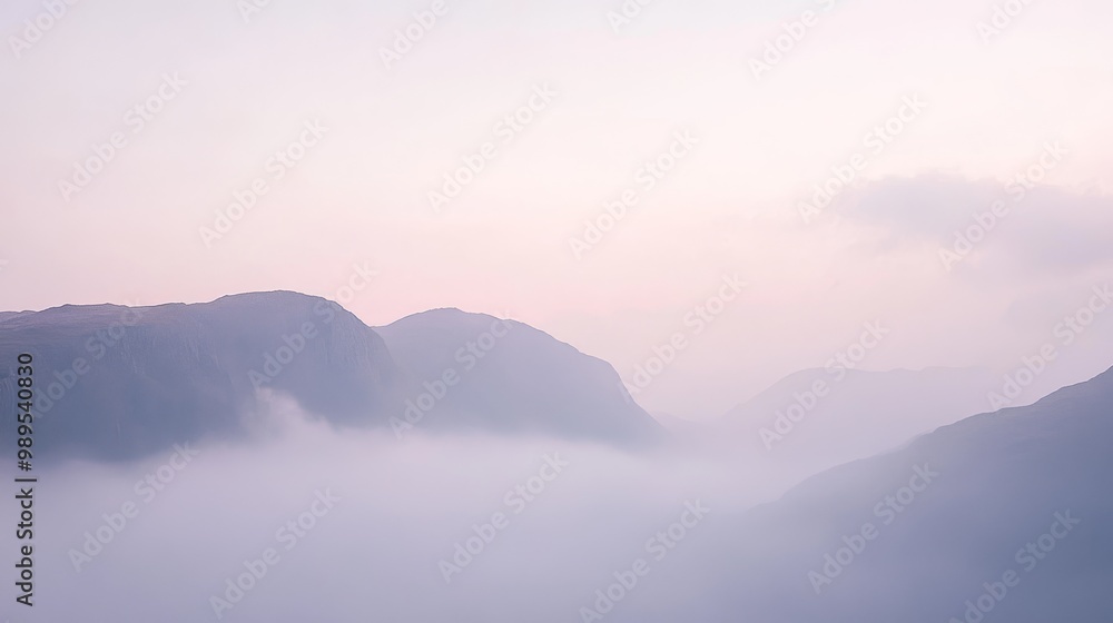 Fototapeta premium Misty Mountain Range at Dawn - A Breathtaking Landscape