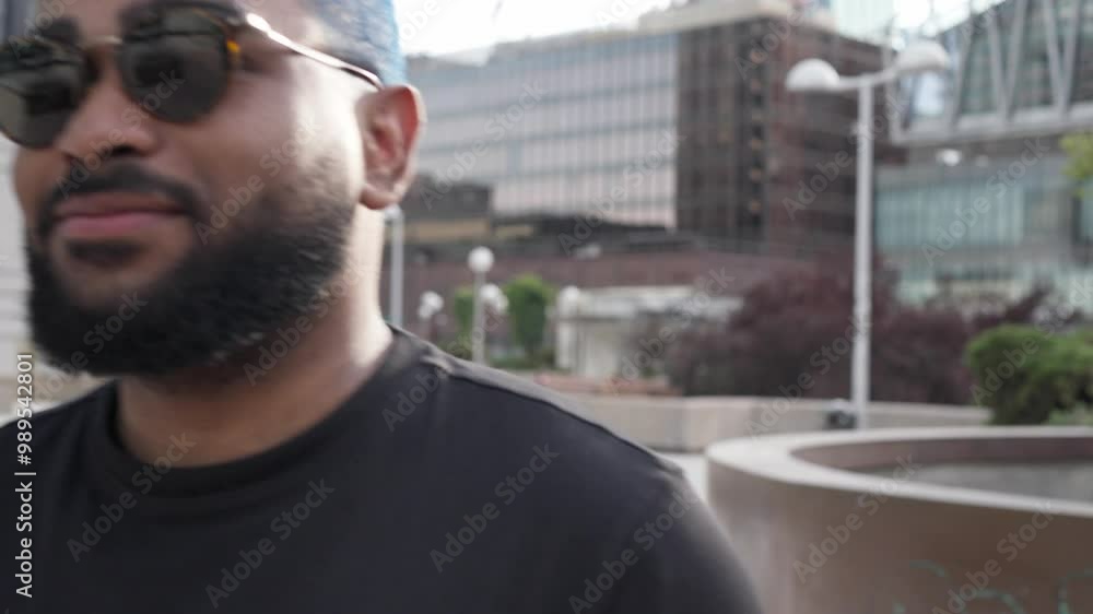 Confident african american man with sunglasses and tablet walking in a modern building environment. Lifestyle and successful success life. Urban street style concept.MOV Confident african american man with sunglasses and tablet walking in a modern building environment. Lifestyle and successful success life. Urban street style concept.MOV